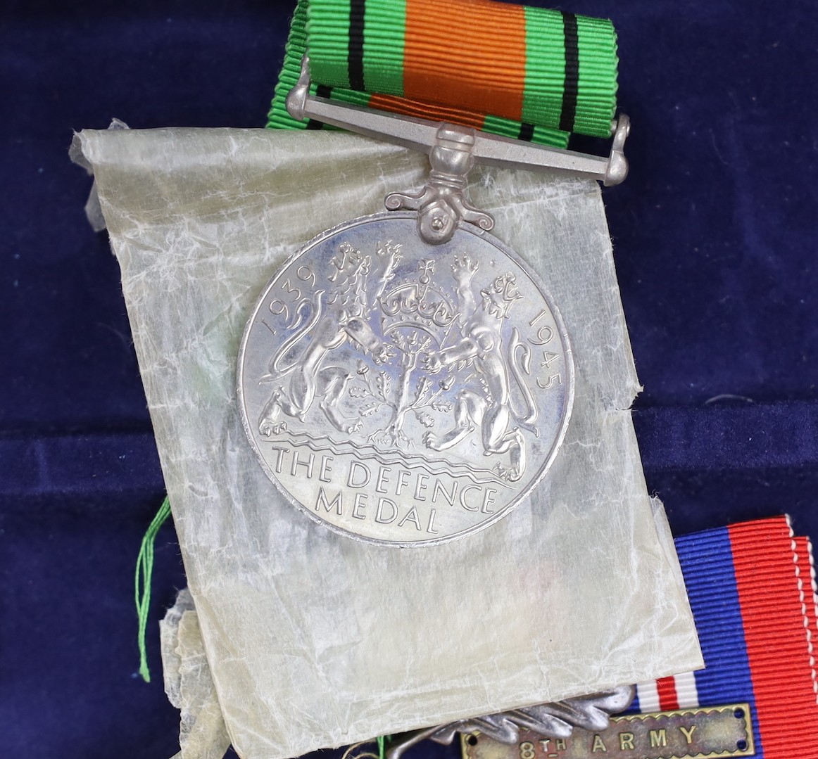 A WWII group of 5 including war medal with oak leaf and 1939-45 star with oak leaf to L.E. TYLER, 8th Army bar (with named box)